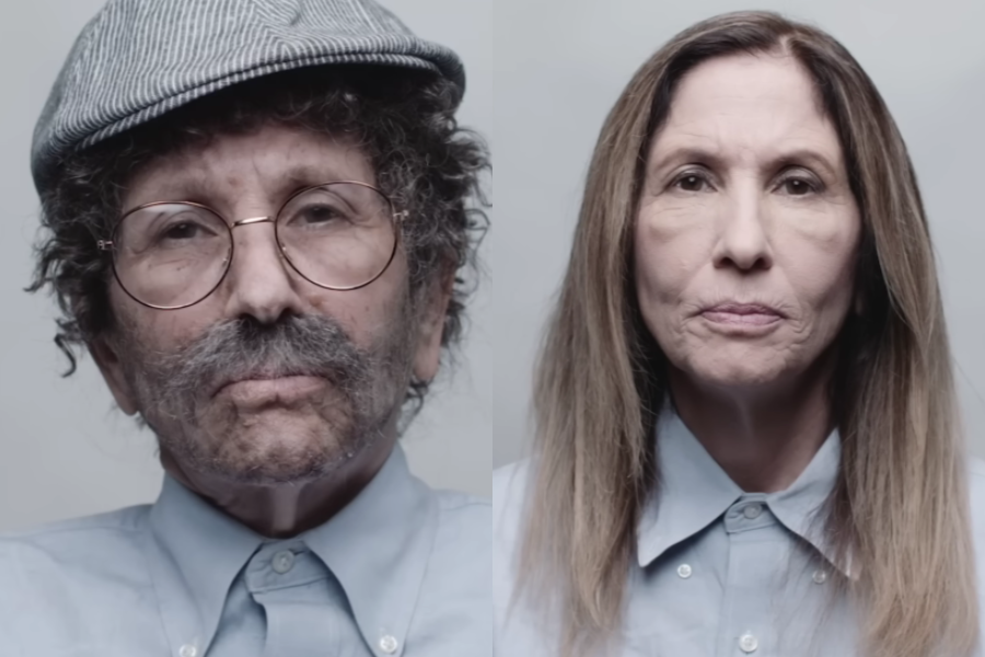 Side-by-side portraits showing a woman before and after a full disguise transformation. On the right, she appears naturally with straight brown hair, a neutral expression, and a buttoned-up shirt. On the left, she is heavily disguised as an older man with curly hair, a flat cap, glasses, mustache, and prosthetic makeup, wearing the same shirt.