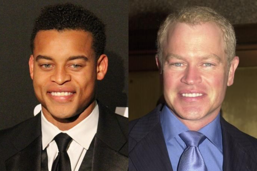 Side-by-side photo of two men smiling at the camera, both dressed in formal suits and ties. The man on the left has short curly hair and a black suit, while the man on the right has short light hair and a dark suit with a blue shirt and shiny blue tie.