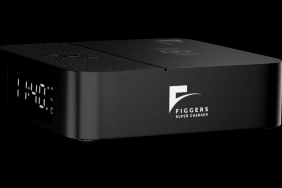 A sleek black Figgers Super Charger with digital clock display and wireless charging symbols on top, set against a black background.