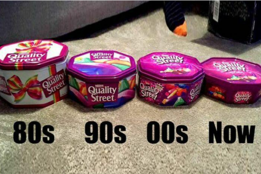 Four Quality Street tins from the 1980s to present, arranged left to right showing a progressive reduction in size over time.
