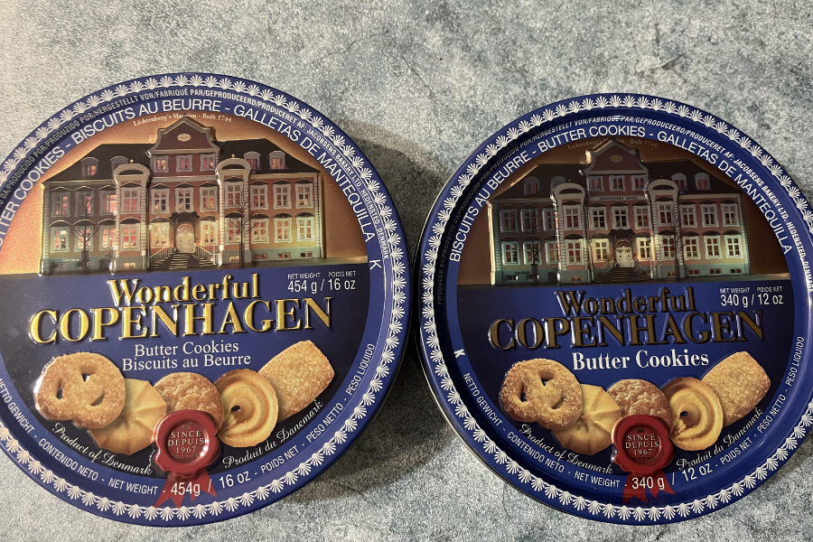Two round tins of Wonderful Copenhagen butter cookies, one 454g and one 340g, featuring an image of a Danish-style building and assorted cookies.