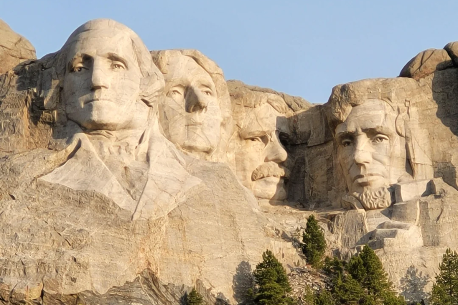The iconic granite carvings of George Washington, Thomas Jefferson, Theodore Roosevelt, and Abraham Lincoln on Mount Rushmore in South Dakota.