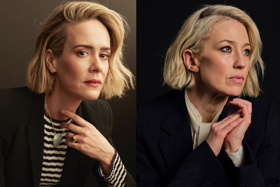 Side-by-side portraits of two women with short, wavy blonde hair, both wearing dark blazers. The woman on the left has a striped shirt and layered necklaces, gazing forward with a thoughtful expression, while the woman on the right has a white blouse and looks off to the side with her hands clasped near her chin.