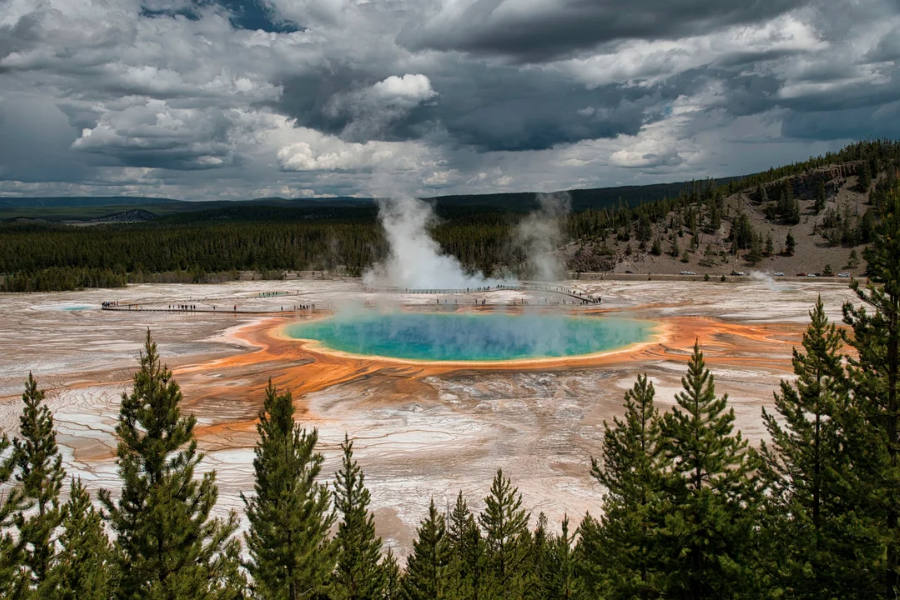 The vibrant Grand Prismatic Spring in Yellowstone National Park steams with brilliant rings of orange, yellow, and turquoise water.