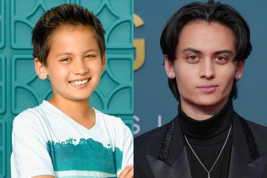 Tenzing Norgay Trainor as a kid in a light blue tee smiling with crossed arms, next to a grown-up version of him in a black turtleneck on the red carpet.