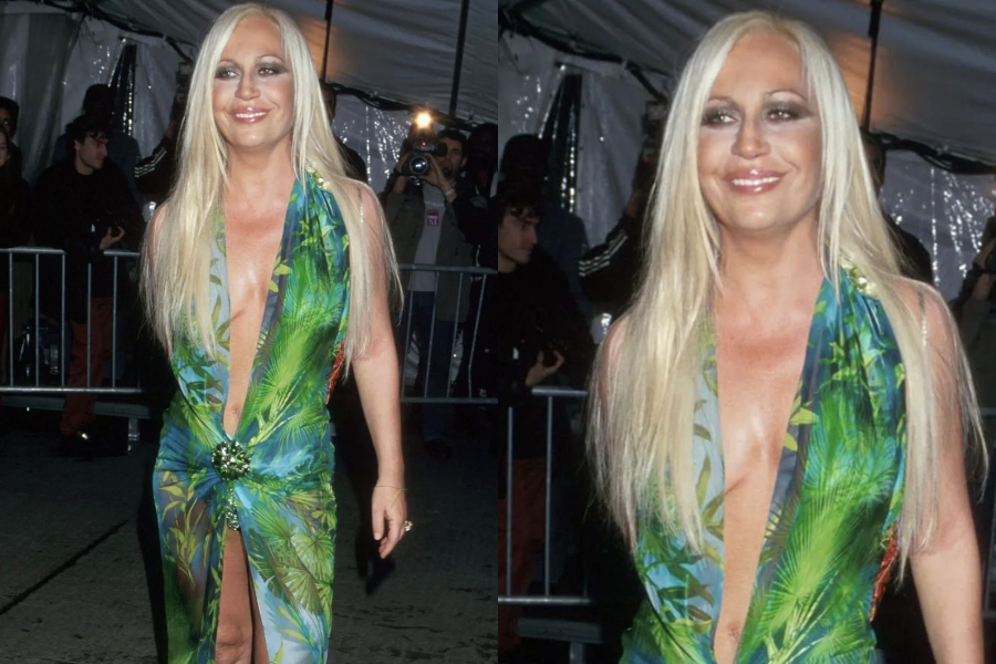 Woman in a plunging green jungle-print gown with a thigh-high slit and long straight platinum hair, smiling as she walks past a crowd and photographers. Second image shows a close-up of her dewy skin and bold smoky eyes.