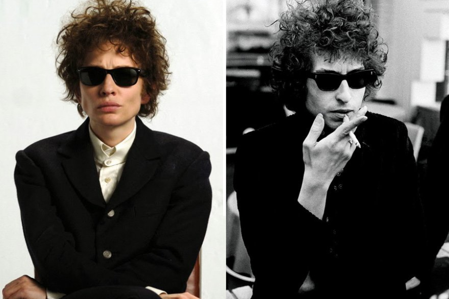 Split image showing a woman dressed and styled like Bob Dylan on the left, and an original black-and-white photo of Bob Dylan smoking on the right, both wearing dark suits and sunglasses.