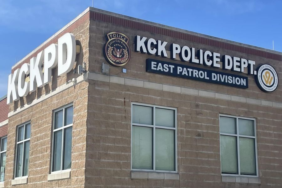 Exterior of the Kansas City Kansas Police Department East Patrol Division building with bold signage and department seals.