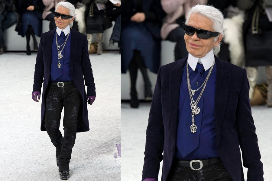 Older man with white hair and dark sunglasses walking a runway in a layered navy outfit, including a long coat, high-collared shirt, and chains. The second shot is a close-up capturing his confident expression.