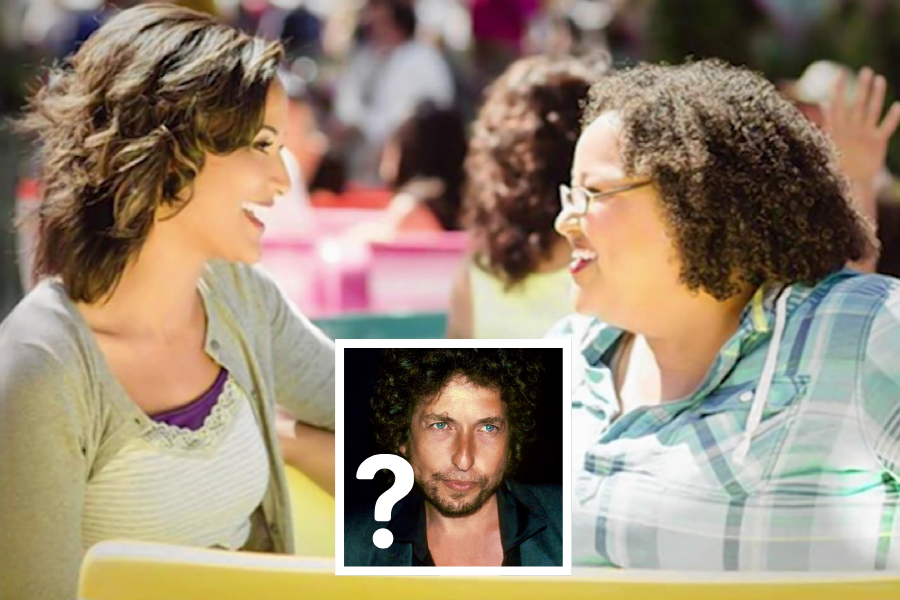 Two women laugh and talk while seated outdoors at colorful tables, with an inset photo of a man with curly hair and blue eyes below them, marked with a question mark.