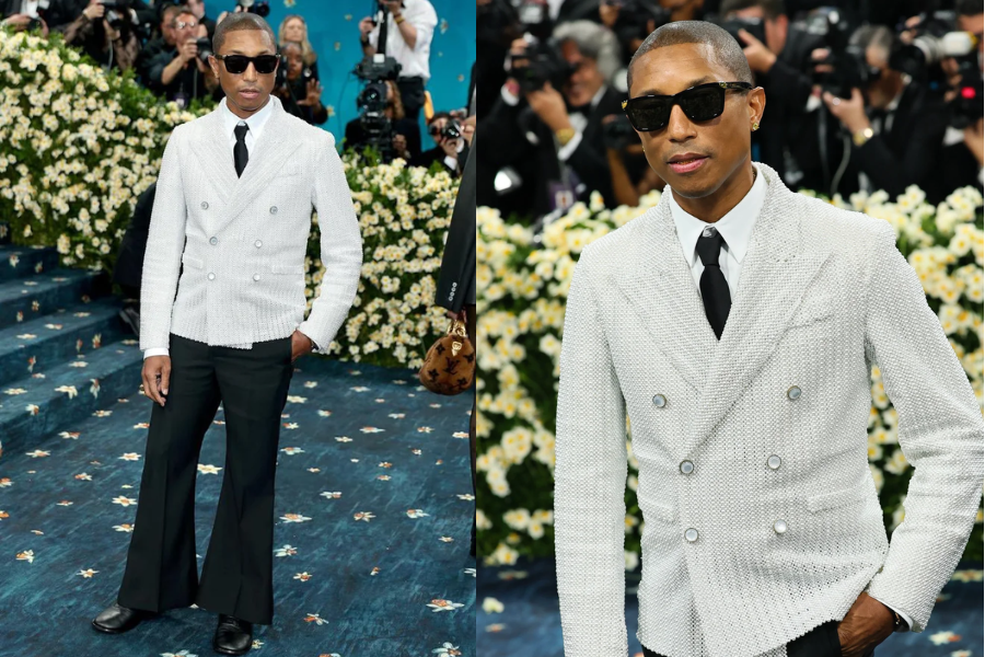Man at a formal event wearing a textured double-breasted white blazer with wide-leg black pants, black tie, and dark sunglasses. Close-up shows a calm expression and sharp tailoring.
