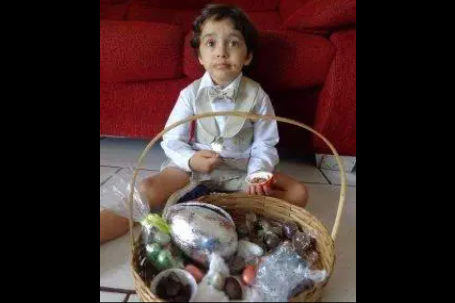 Young Matheus eating easter eggs