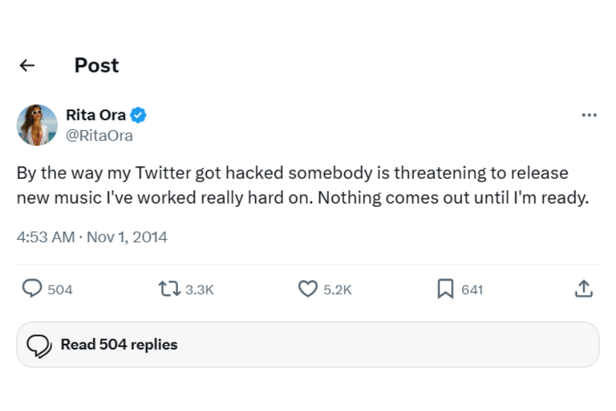 A tweet from a verified account on November 1, 2014, mentions a Twitter hack and a threat to release unreleased music. Icons below show engagement. Tweet reads: By the way my Twitter got hacked somebody is threatening to release new music I've worked really hard on. Nothing comes out until I'm ready."