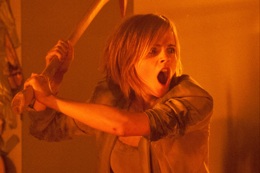 A person with short hair holds a large axe overhead, mouth open in a shout. The scene is lit with a warm, intense orange glow, conveying urgency.