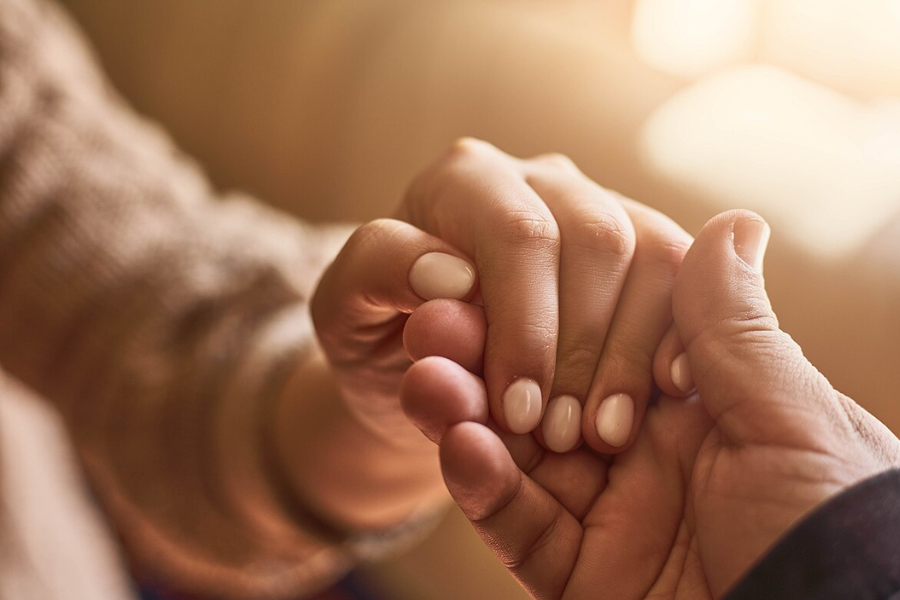 Compassion holding hands