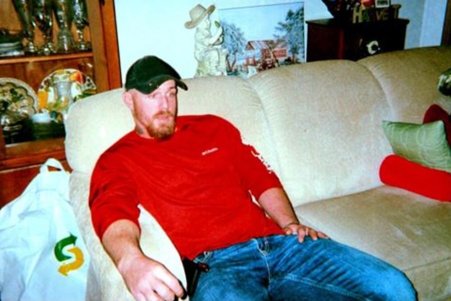 Bold Man sittiong the couch